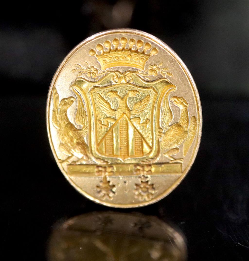 An early 19th century French 18ct gold fob seal, carved with ornate crest,